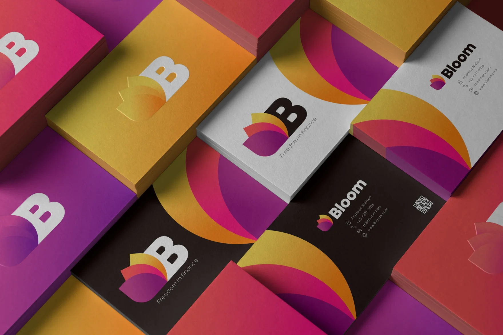A mesh of business cards, with the Bloom branding. It is in the different colors that match the colors in Bloom's visual identity